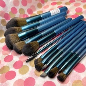14 pc makeup brush set. wood/aluminum shimmery blue handles. Nylon wool brushes